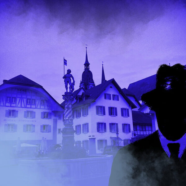 Dies ist das Titelbild des Find-the-Code Zofingen Standard Spiel - Farbangriffe auf das Frohburger Städtchen. Dieses Bild zeigt den verrückten Kriminellen von Find-the-Code, dem Outdoor Escape Game, als Schatten vor der Altstadt in Zofingen. Im Hintergrund ist der Niklaus Thut Brunnen zu sehen.